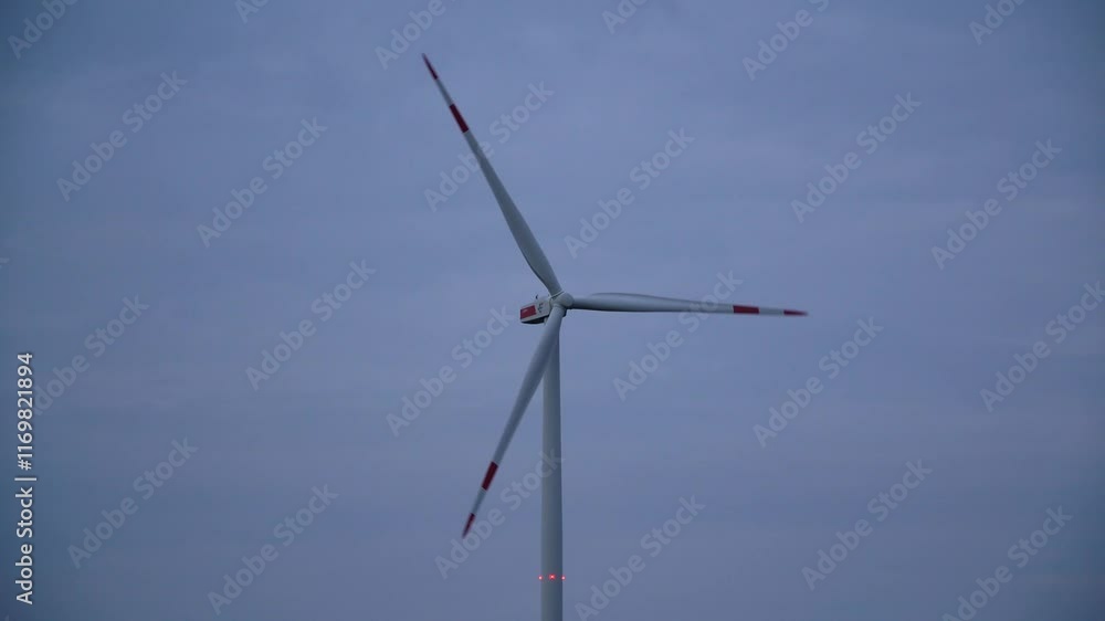 Wind Turbine Silhouetted Against A Breathtaking Evening Sky, Emphasizing Sustainable Energy Solutions, Showcasing Modern Technology In Harmony With Nature, And Inspiring Eco-Friendly Progress. Wind Turbine Silhouetted Against A Breathtaking Evening Sky, Emphasizing Sustainable Energy Solutions, Showcasing Modern Technology In Harmony With Nature, And Inspiring Eco-Friendly Progress.