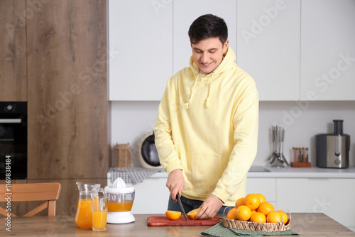 Young man making sweet oran...