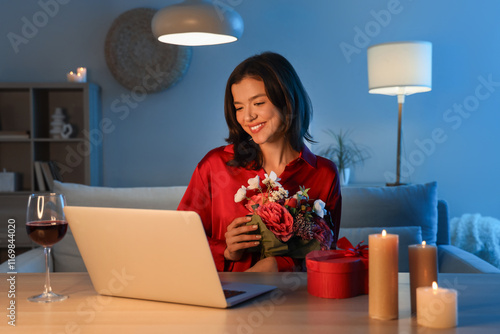 Young woman with flowers ha...