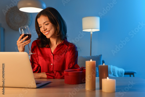 Young woman with wine havin...