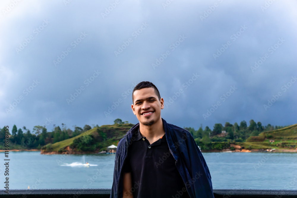 Fototapeta premium People smiling. Latin man happy on vacation visiting Colombian towns and traveling. Excursions and trips.