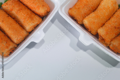 Risoles or risoles, is a traditional Indonesian snack. It contains mayonnaise mixed with eggs, sausage, vegetables and sometimes minced chicken, sprinkled with breadcrumbs and fried. photo