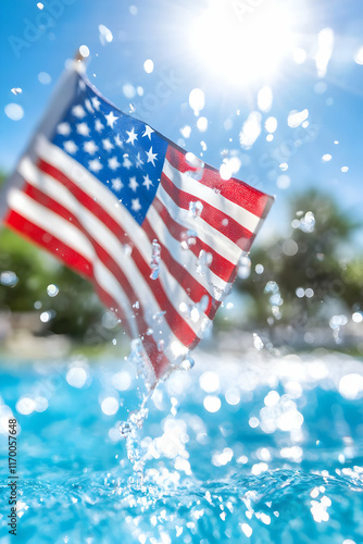 American flag splashing in a pool on a sunny day.
