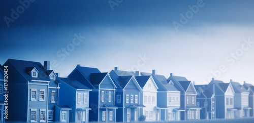 	
A small model of houses in blue and white colors. Real estate market growth	
