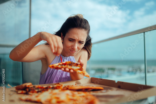 Picky Eater Taking out Pepper from Pizza Disliking vegetables. Unhappy customer demanding certain pizza toppings selection 
 photo