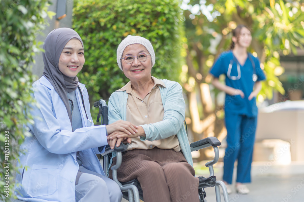 a young female health care worker in hijab take care senior cancer patient in wheelchair,talking,empowering,empathy,mental care a young female health care worker in hijab take care senior cancer patient in wheelchair,talking,empowering,empathy,mental care