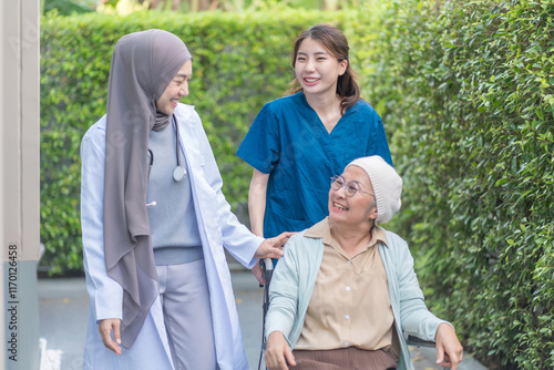 health care workers take care senior cancer patient in wheelchair,talking,empowering,empathy,mental care
