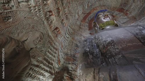 The Yungang Grottoes in Datong, Shanxi Province, China, were originally built 1500 years ago during the Northern Wei Dynasty, featuring,Ancient Buddha sculptures