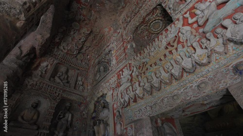 The Yungang Grottoes in Datong, Shanxi Province, China, were originally built 1500 years ago during the Northern Wei Dynasty, featuring huge and exquisite Buddha sculptures