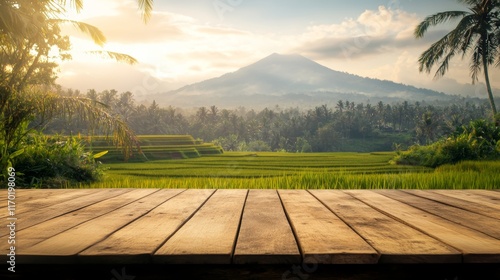 Wooden table top on blur rice field mountain and grass fieldFresh and Relax conceptFor montage product display or design key visual layoutView of copy space photo