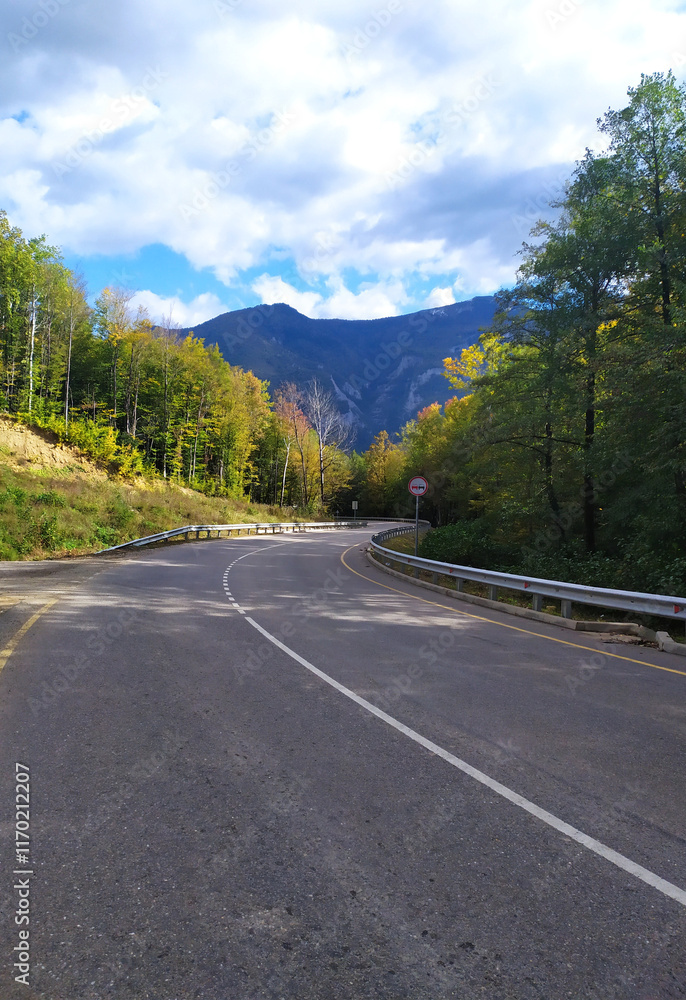 paved highway in a mountainous area in early autumn with panoramic views paved highway in a mountainous area in early autumn with panoramic views