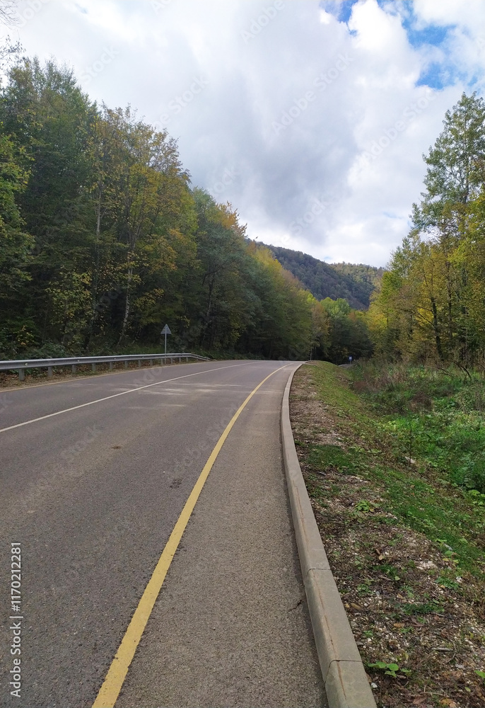 paved highway in a mountainous area in early autumn with panoramic views paved highway in a mountainous area in early autumn with panoramic views