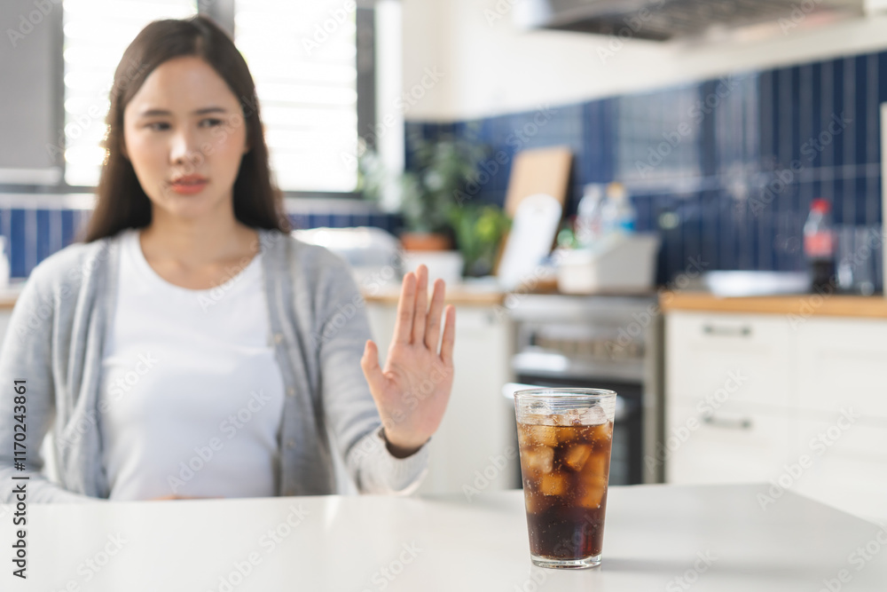 Diet, Dieting. Attractive asian young woman, girl push out cold cola, refuse carbonated soft drink soda, sparkling water by her hand. Health care, healthy lifestyle concept, avoid limits sweet sugar. Diet, Dieting. Attractive asian young woman, girl push out cold cola, refuse carbonated soft drink soda, sparkling water by her hand. Health care, healthy lifestyle concept, avoid limits sweet sugar.