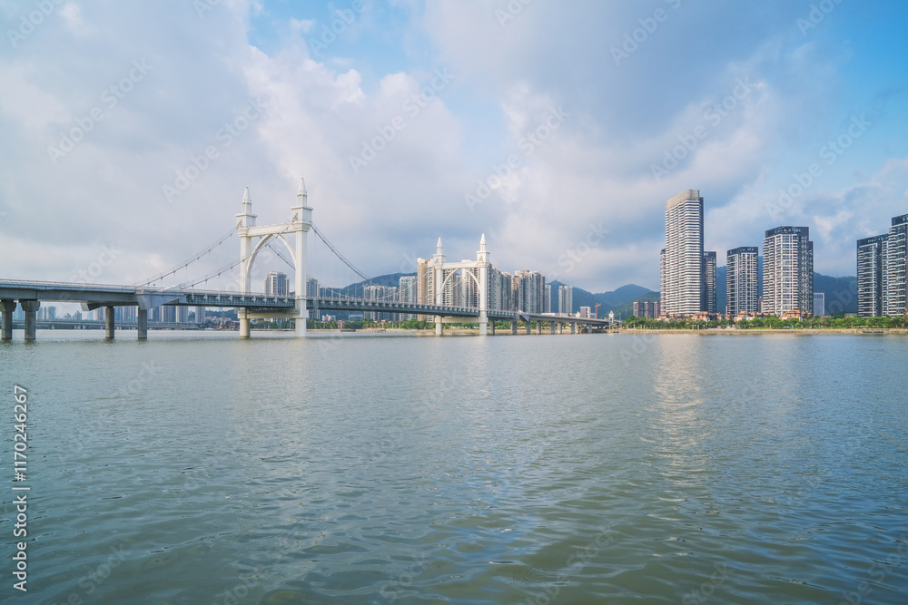 Modern urban architecture, bridges, and coastal scenery in Zhuhai, Guangdong Province, China on April 9, 2023 Modern urban architecture, bridges, and coastal scenery in Zhuhai, Guangdong Province, China on April 9, 2023