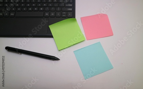 Business Desk with Laptop, Pen, and Colorful Office Stationery photo