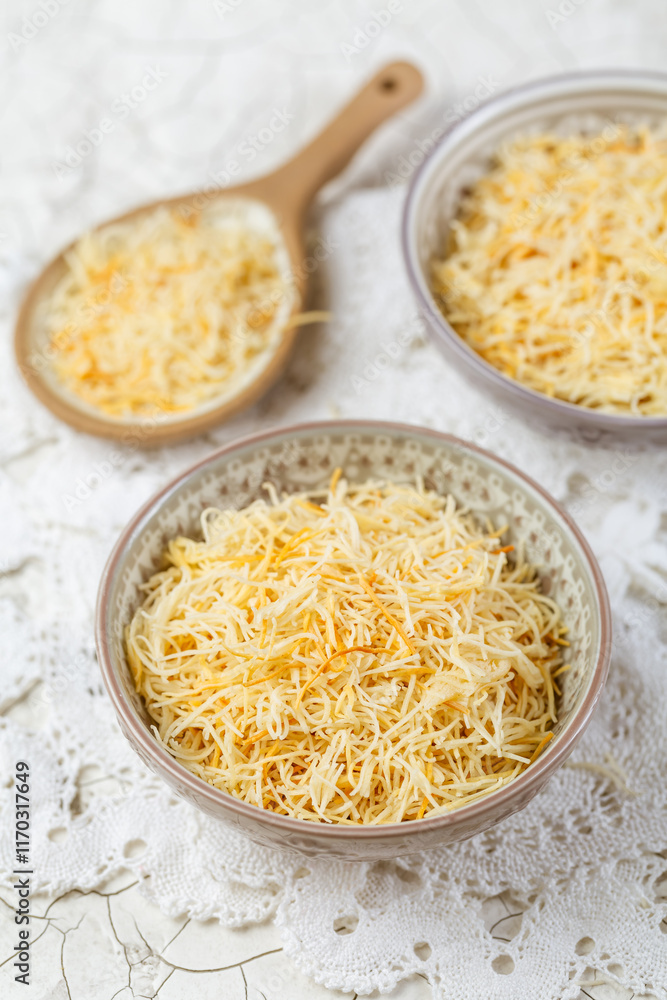 Butter roasted Kadayif pastry, fine dough threads for delicious sweet desserts, Turkish cuisine Butter roasted Kadayif pastry, fine dough threads for delicious sweet desserts, Turkish cuisine