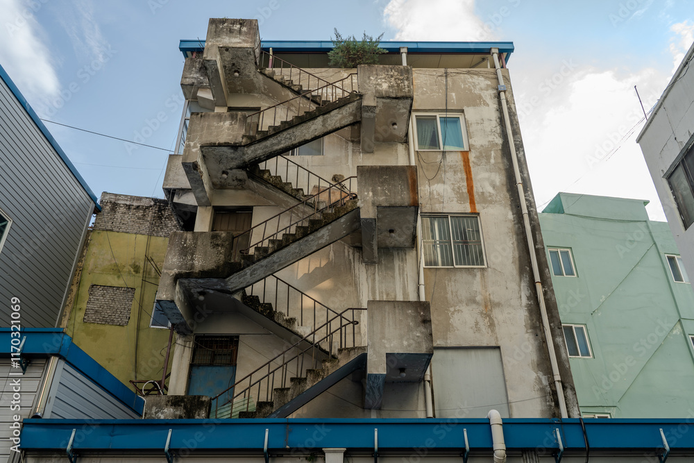 A staircase architecturally connecting upper and lower floors, creating a vertical link between spaces.