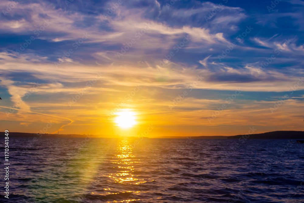 Evening sky-water summer landscape of the sunset over the horizon. Evening sky-water summer landscape of the sunset over the horizon.