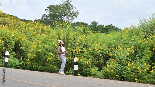 Wallpaper Mural Asian woman walking on the road on Doi Pae Luang hill an iconic viewing point in Phaya Mengrai District in Chiang Rai province of Thailand. Torontodigital.ca