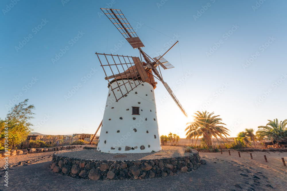 One beautiful spanish isolated ancient white traditional stone windmill