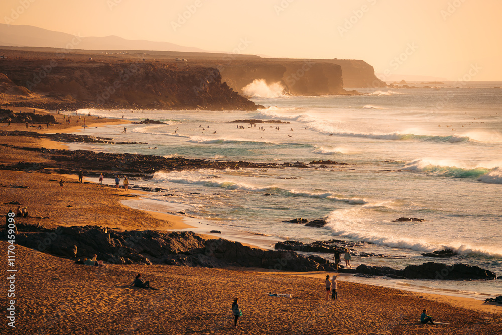 Stunning view of the El Cotillo beach with a rocky coastline in the distance.