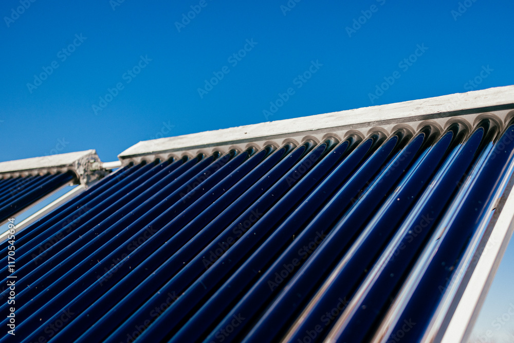 Fototapeta premium Solar water heater using renewable energy for efficient water heating. An eco-friendly solution for sustainable living.