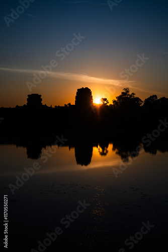 Wallpaper Mural All seeing.  Sunrise at Angkor Wat reflected in the surrounding water Torontodigital.ca