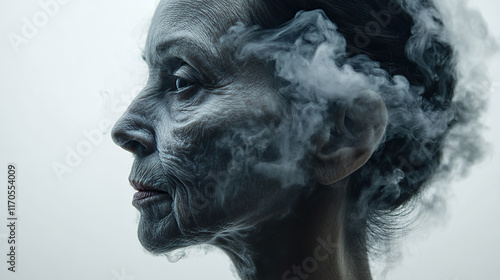 A dramatic profile portrait of an elderly woman, her face partially obscured by ethereal smoke, conveying themes of age and mystery photo