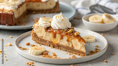 Wallpaper Mural Deliciously rich banoffee pie slice adorned with whipped cream and caramel drizzle on a rustic plate Torontodigital.ca