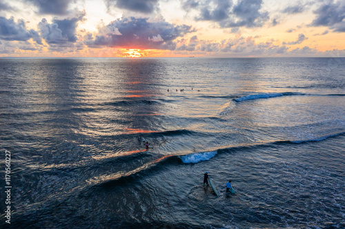 Aerial view of surfers at Cloud 9 at sunrise, Siargao island, Surigao del Norte, Philippines photo