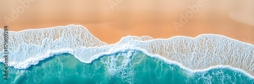 Summer seascape beautiful waves, blue sea water in sunny day. Top view shore drone. Sea coast aerial view, amazing tropical tranquil nature. Beautiful bright sea with waves splashing and beach sand