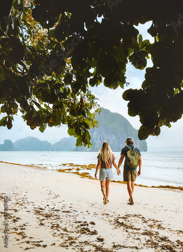 Couple in love walking on Vanilla beach in Palawan, Philippines - travel romantic vacations outdoor lifestyle man and woman together enjoying summer trip honeymoon