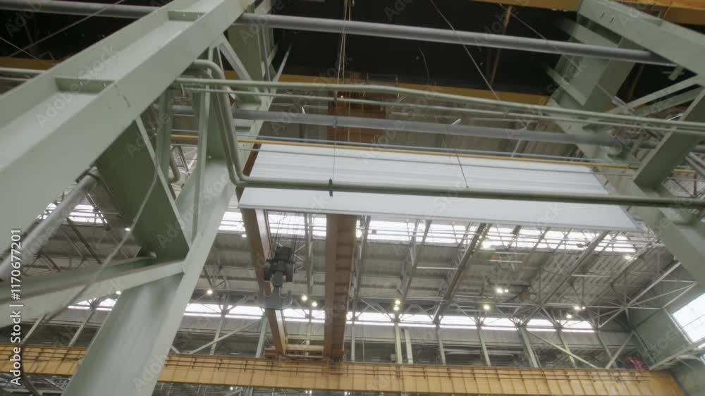 An industrial facility with overhead cranes and a strong steel framework for efficiency. Stock Clip An industrial facility with overhead cranes and a strong steel framework for efficiency. Stock Clip