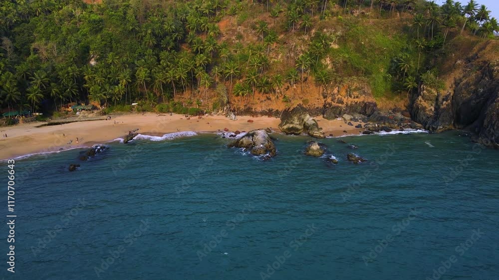 Aerial drone shot of Kakolem Beach at sunset, revealing its untouched charm and beauty. Aerial drone shot of Kakolem Beach at sunset, revealing its untouched charm and beauty.