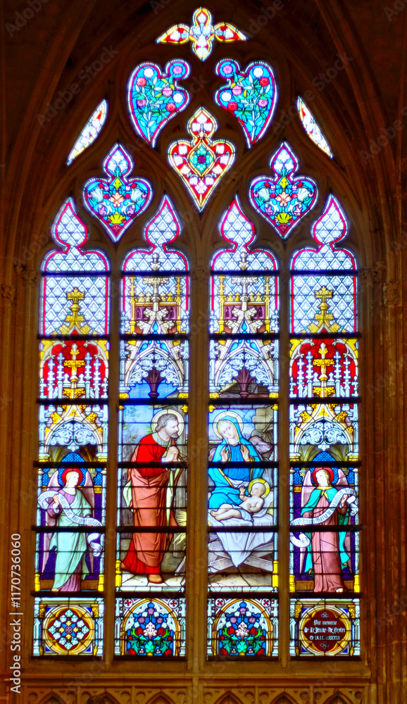 Gothic stained glass representing the nativity scene in the famous Tongeren Basilica, Belgium. Gothic stained glass representing the nativity scene in the famous Tongeren Basilica, Belgium.