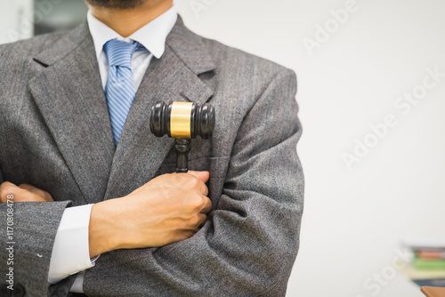 Canvas Print Male lawyer diligently examines documents placed on his desk, demonstrating his professionalism and dedication to finding legal truth, analyzing ideas, and pursuing justice with relentless focus