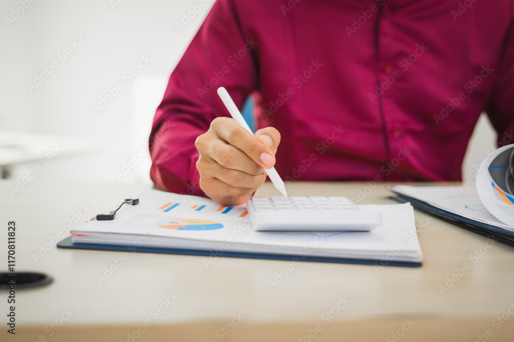 A focused man works diligently in his office, reviewing numerous accounting documents on his desk. His goal is to ensure accuracy and precision, avoiding errors in critical financial data. A focused man works diligently in his office, reviewing numerous accounting documents on his desk. His goal is to ensure accuracy and precision, avoiding errors in critical financial data.