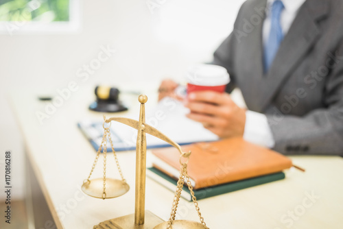 Male lawyer diligently examines documents placed on his desk, demonstrating his professionalism and dedication to finding legal truth, analyzing ideas, and pursuing justice with relentless focus. photo