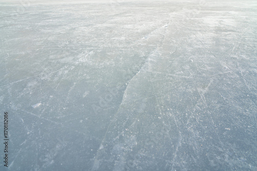 hockey puck and ice on the scratches surface abstract background ice arena photo