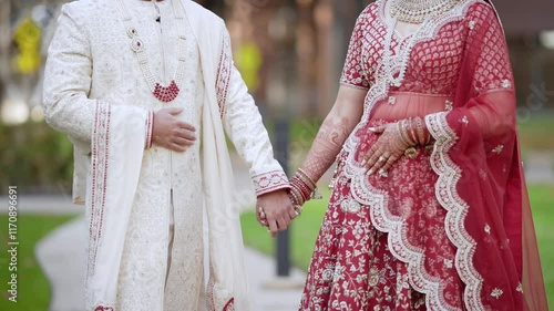Couple standing together. Woman dressed in traditional Indian clothes, hindu wedding. Close up