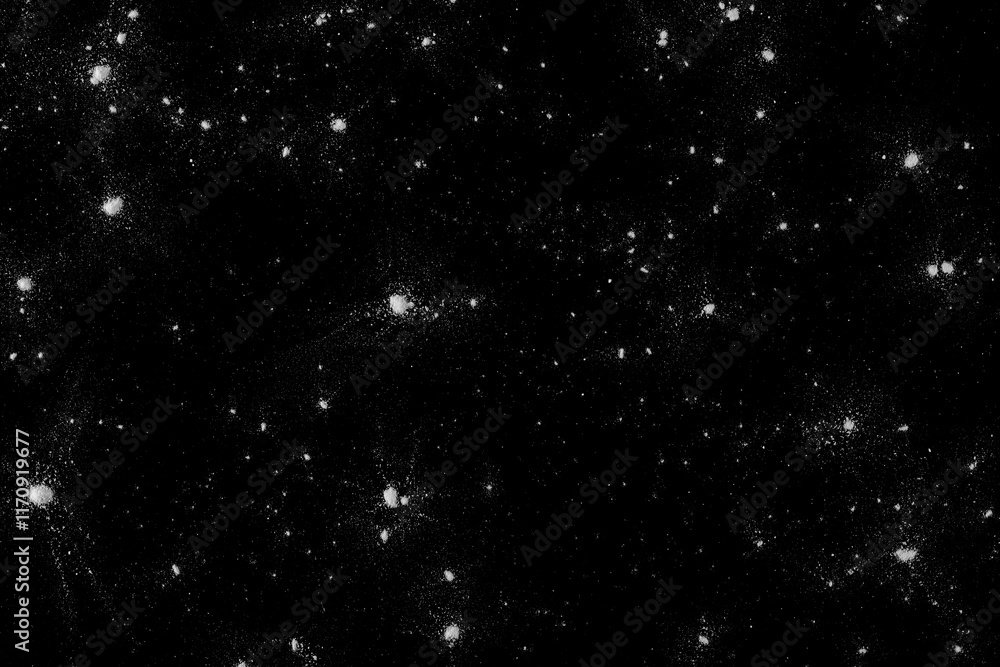 Obraz premium Powder white sugar scattered, isolated on black, top view and clipping