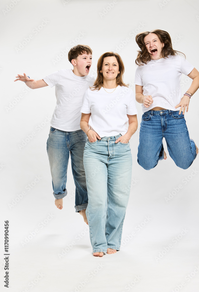 Studio portrait of mother with two teenage kids. Studio portrait of mother with two teenage kids.