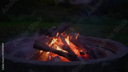 Wallpaper Mural Warm wood crackling fireplace with glowing flames in slow motion - tranquil outdoor dark evening Torontodigital.ca