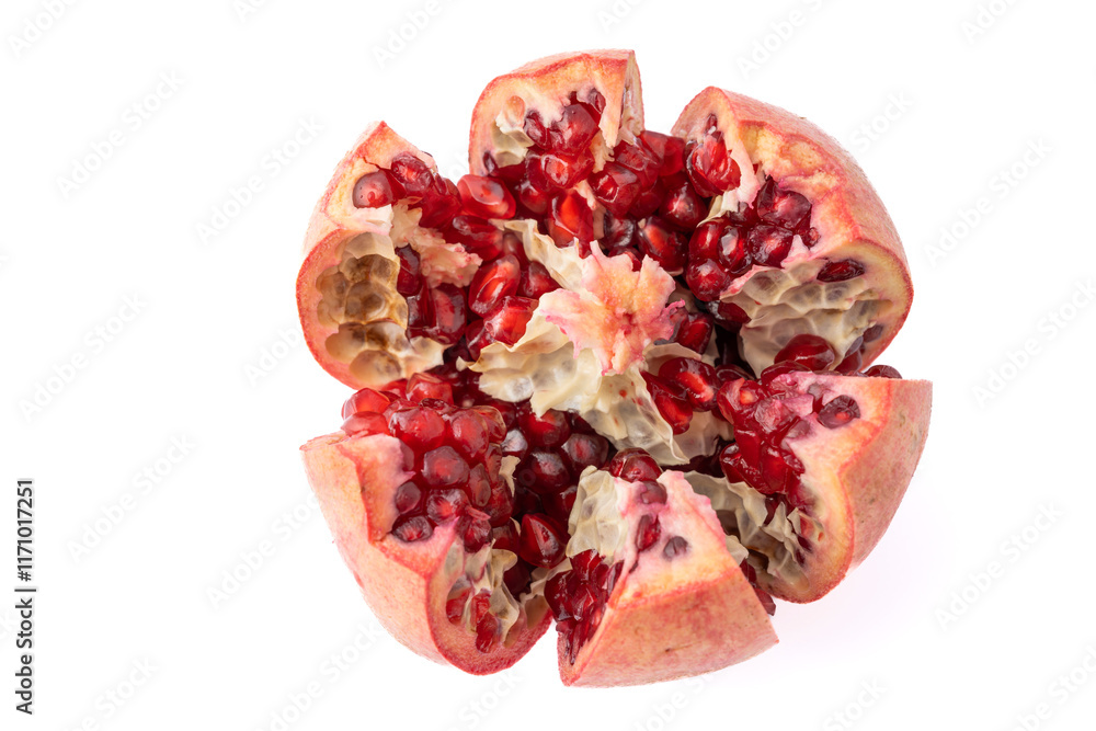 Gennevilliers, France - 01 02 2024: Close up of one cut red pomegranate on a white background. Gennevilliers, France - 01 02 2024: Close up of one cut red pomegranate on a white background.
