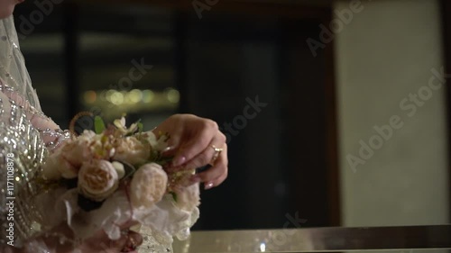 Bride's hand and flower