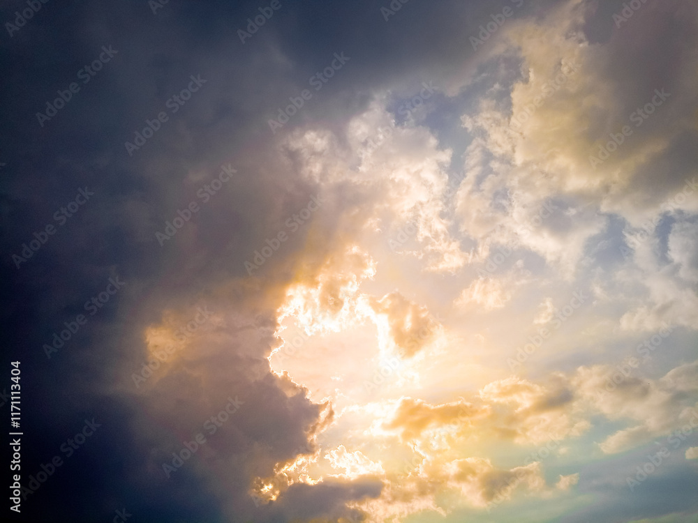 Fototapeta premium beautiful clouds on sunset sky.The summer sky in the clouds and the sunset rays