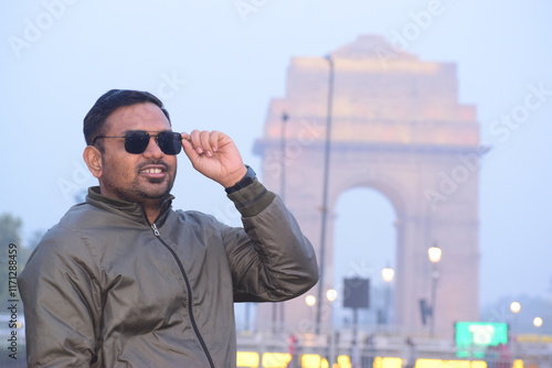 Indian Men or boy  smile  wear the sunglasses near India Gate ,Delhi ,India photo