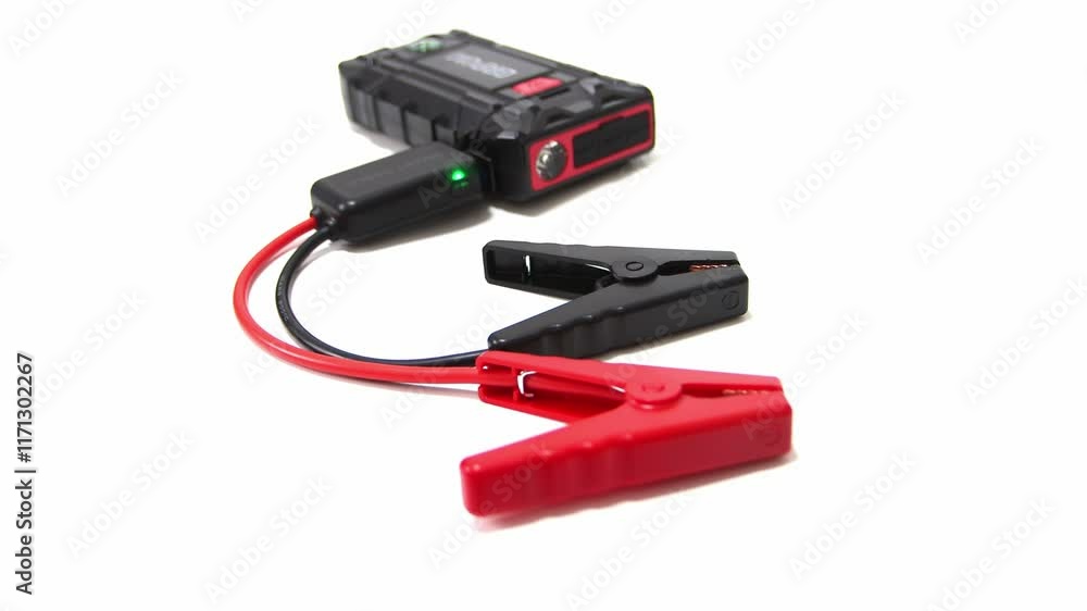Vehicle battery jump starter. Isolated on a white background. Car, motorcycle, boat, battery, clamp, maintenance. Vehicle battery jump starter. Isolated on a white background. Car, motorcycle, boat, battery, clamp, maintenance.