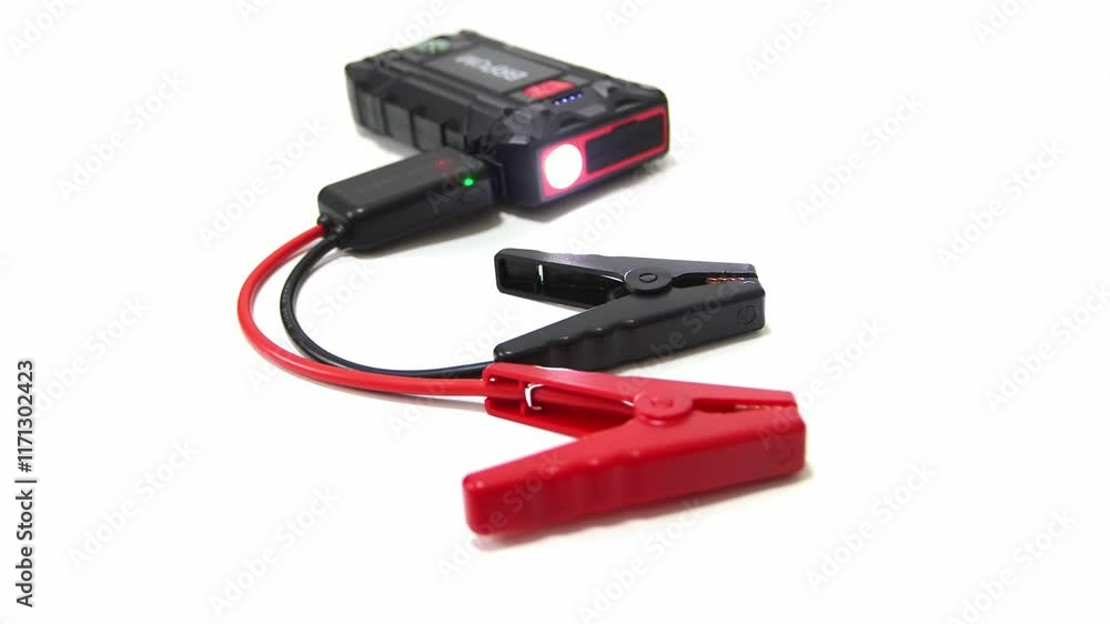 Vehicle battery jump starter. Isolated on a white background. Car, motorcycle, boat, battery, clamp, maintenance. Vehicle battery jump starter. Isolated on a white background. Car, motorcycle, boat, battery, clamp, maintenance.