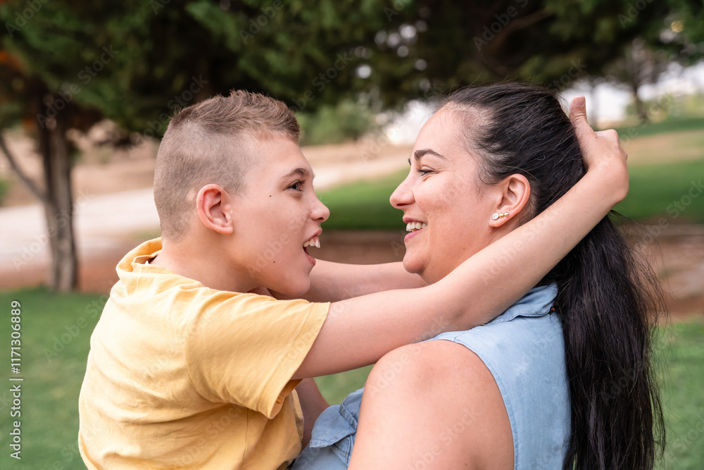 Mother and disabled son sharing a joyful moment in the park